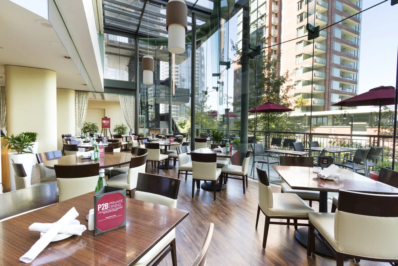 P2B Bistro & Bar dining room with floor-to-ceiling windows at Pinnacle Hotel Harbourfront